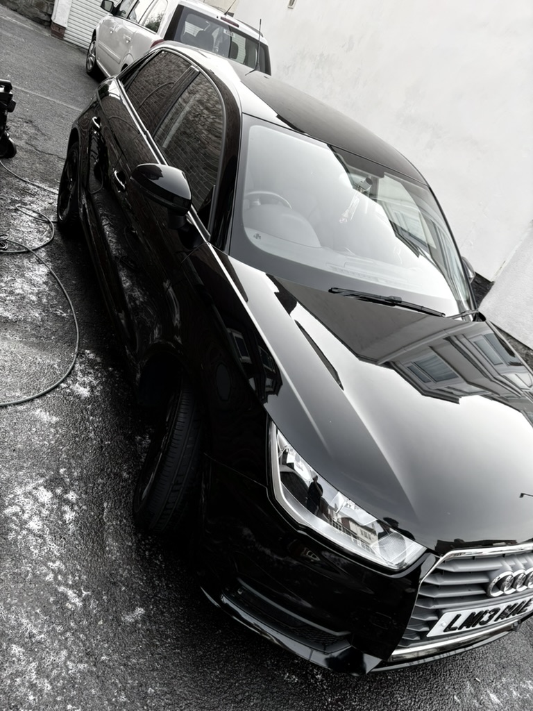 Black Audi after wash with mirror-finish paintwork